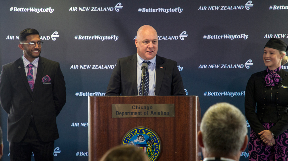 Air New Zealand CEO Christopher Luxon, flanked by cabin crew Jessica Brennan and Vishal Patel.