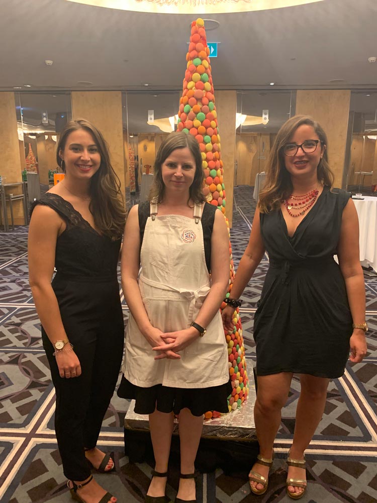 Sarah Elfassy, Sophie Almin and Camille Chevallier from Atout France, with the macron tower in the background.